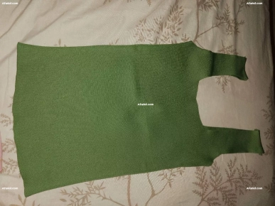 pull vert dans un bon état