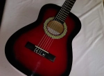 Annonce d'Offre catégorie Musique et instruments à Sakiet Eddaïer région de Sfax: Guitare classique rouge avec saccoche 
